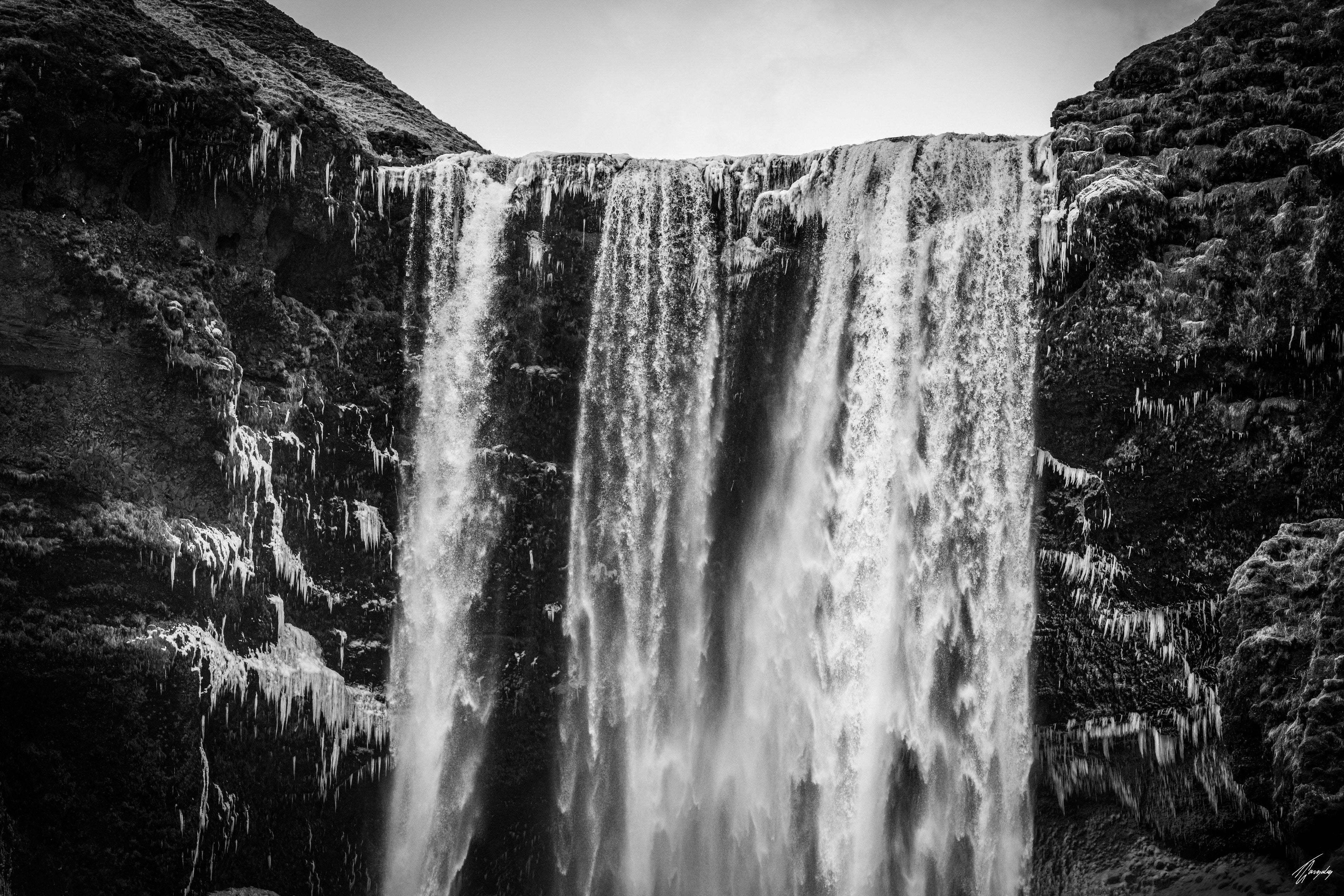Crystallized Skogafoss waterfall in Iceland wall decor print detailed frozen textures and ice formations in clean minimalist composition